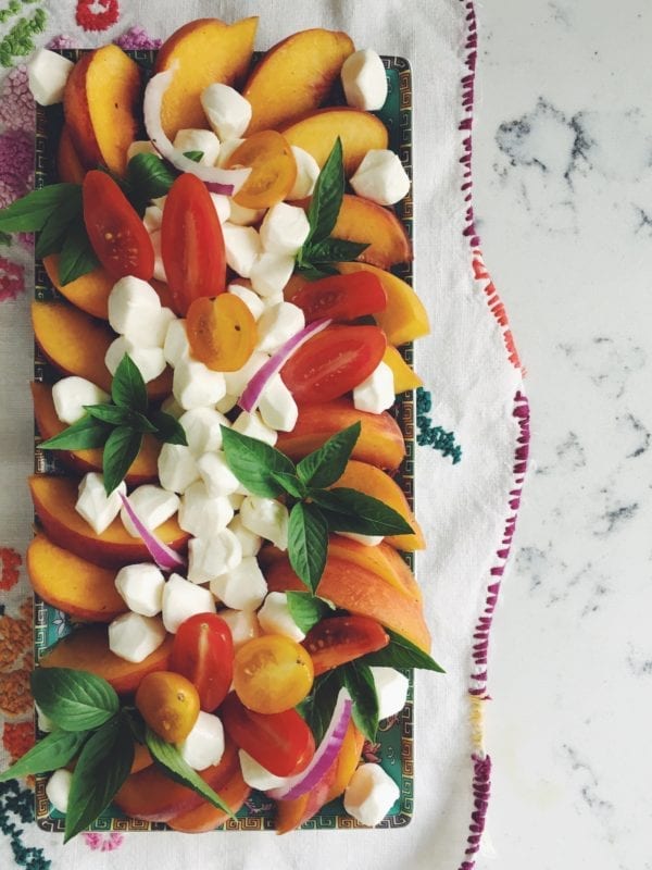 Savor summer forever with this quick and easy peach, mozzarella and thai basil salad!