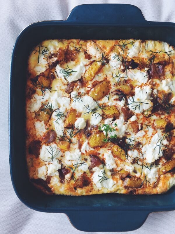 squash frittata in a green baking dish