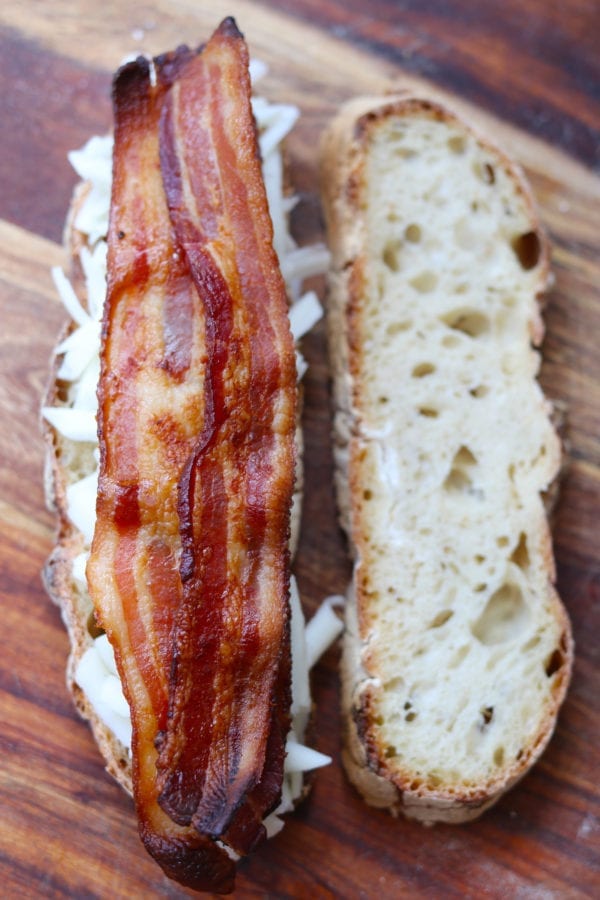 goats milk cheddar grilled cheese with sour cherry jam, crispy fried sage, bacon + black pepper butter on sourdough