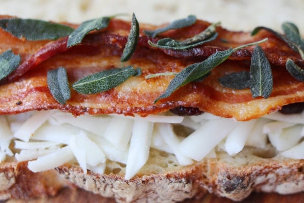 goats milk cheddar grilled cheese with sour cherry jam, crispy fried sage, bacon + black pepper butter on sourdough
