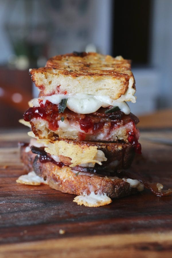 goats milk cheddar grilled cheese with sour cherry jam, crispy fried sage, bacon + black pepper butter on sourdough