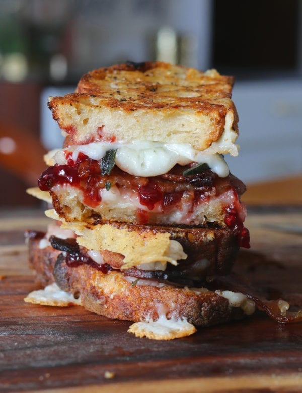 goats milk cheddar grilled cheese with sour cherry jam, crispy fried sage, bacon + black pepper butter on sourdough