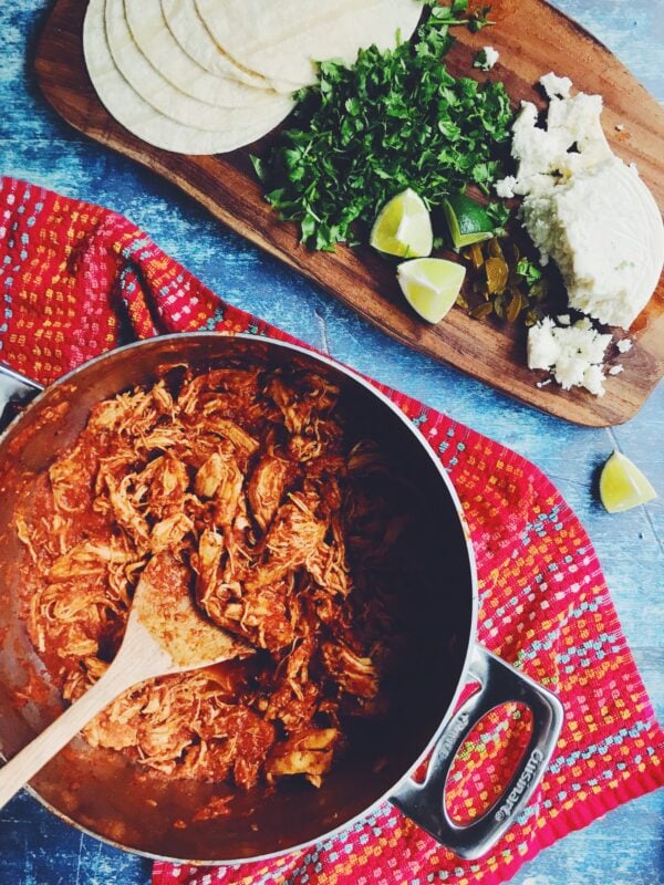 the easiest spicy chicken tinga recipe ever! Perfect mexican shredded chicken for tacos, quesadillas, salad bowls and tostadas!