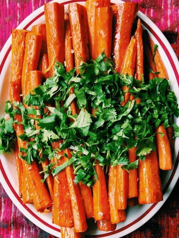 Up close shot of carrots with fresh cilantro on top