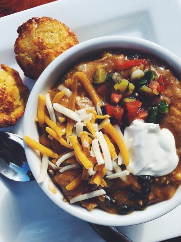 Deer Valley's Famous Turkey Chili with two corn muffins on a white plate