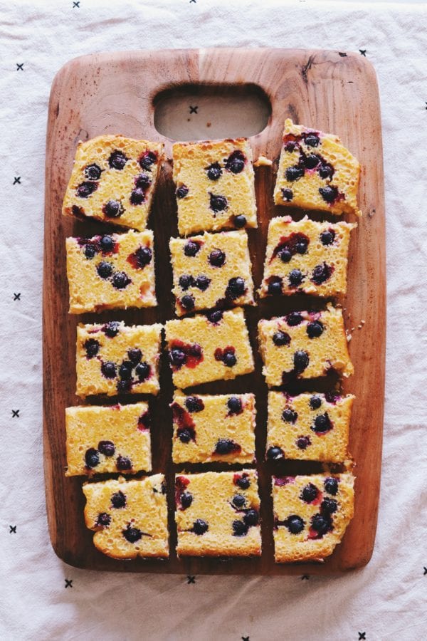 blueberry lemon ricotta bars on a cutting board