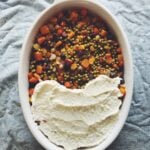 honey roasted root vegetable shepherds pie in a large white bowl