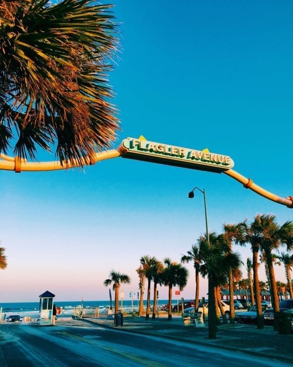 a picture of new smyrna beach's logo street sign