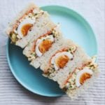 egg salad sandwiches on a blue plate