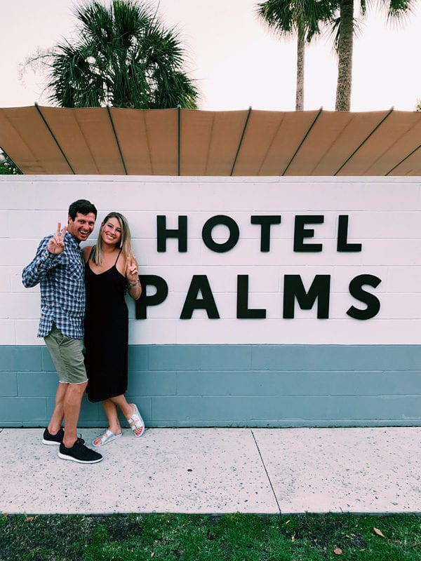 2 people standing in front of Hotel Palms Atlantic Beach Jacksonville Florida