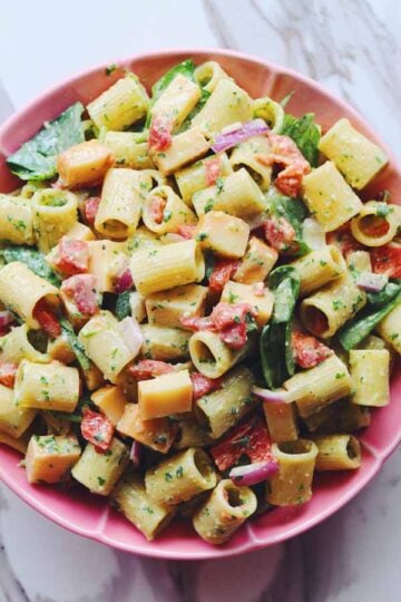 smoked mozzarella pasta salad in a pink bowl