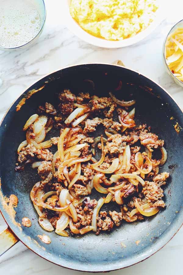 sausage and onions in a pan
