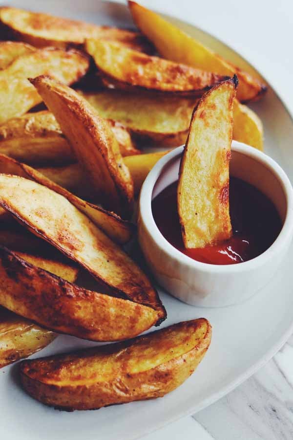 air fryer potato wedges on a white plate