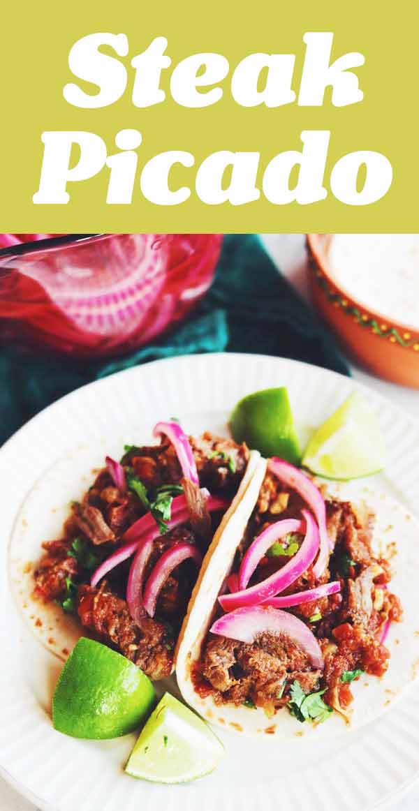 This Steak Picado recipe is on constant rotation in our house! It's a spicy, savory and tender Mexican steak dish that's slow cooked for 2 hours until it falls apart. It's perfect piled onto tacos or served on a platter with rice and beans!