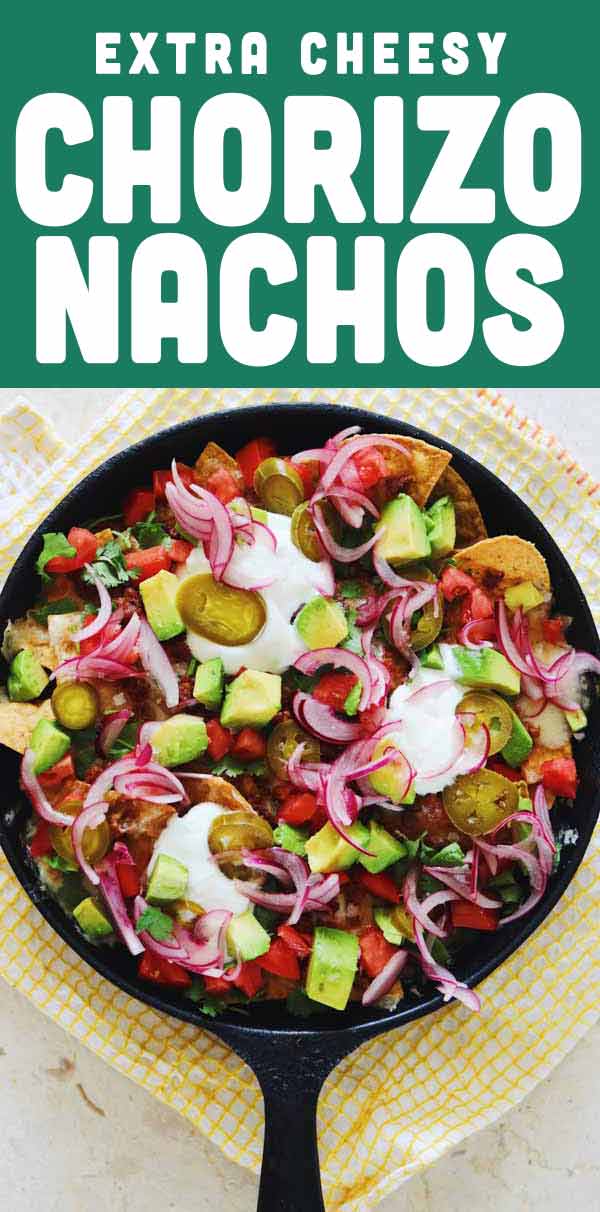 These chorizo nachos are so delicious! Whether you serve them as an appetizer, snack or dinner, they deliver! Packed with tons of cheese, chorizo, and tasty colorful toppings, and baked until bubbling and delicious - it’s no surprise that everyone loves them! #appetizer #snack #tailgate #partyfood #nachos #chorizo #cheese #ovenbaked #mexicanrecipe