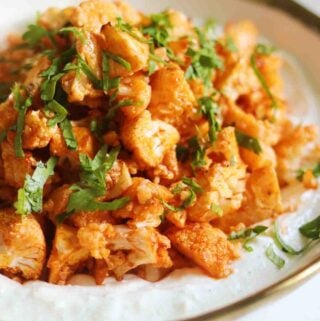 ¾ angle of a bowl of buffalo cauliflower and cottage cheese ranch.