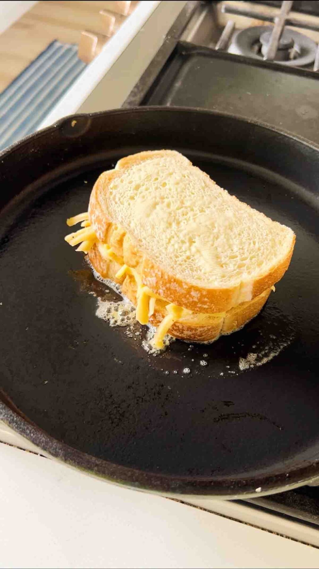 a grilled cheese in a great jones king sear frying pan.