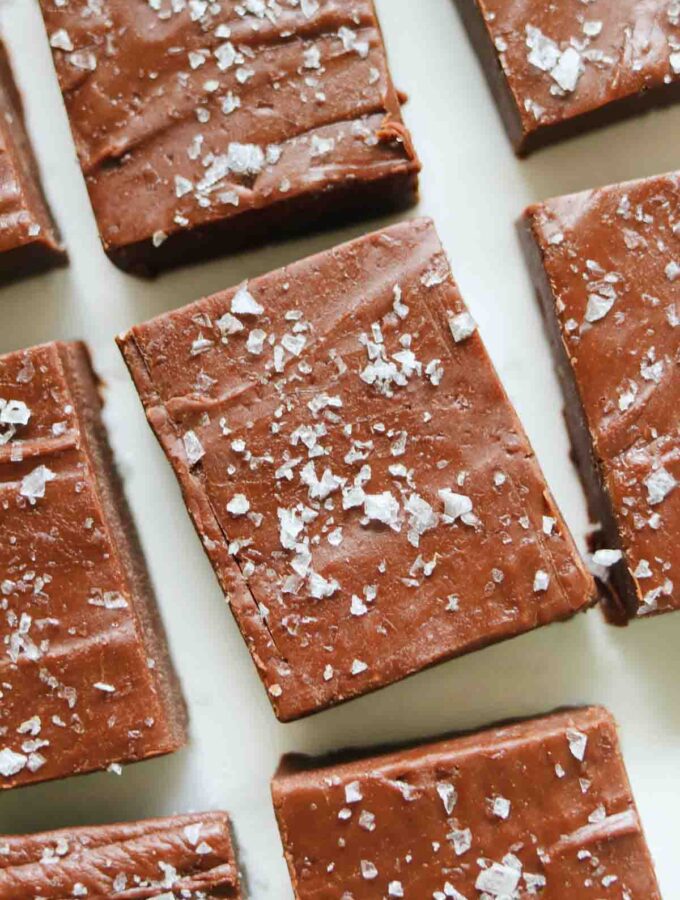 close up of nutella fudge rectangles on a white countertop.