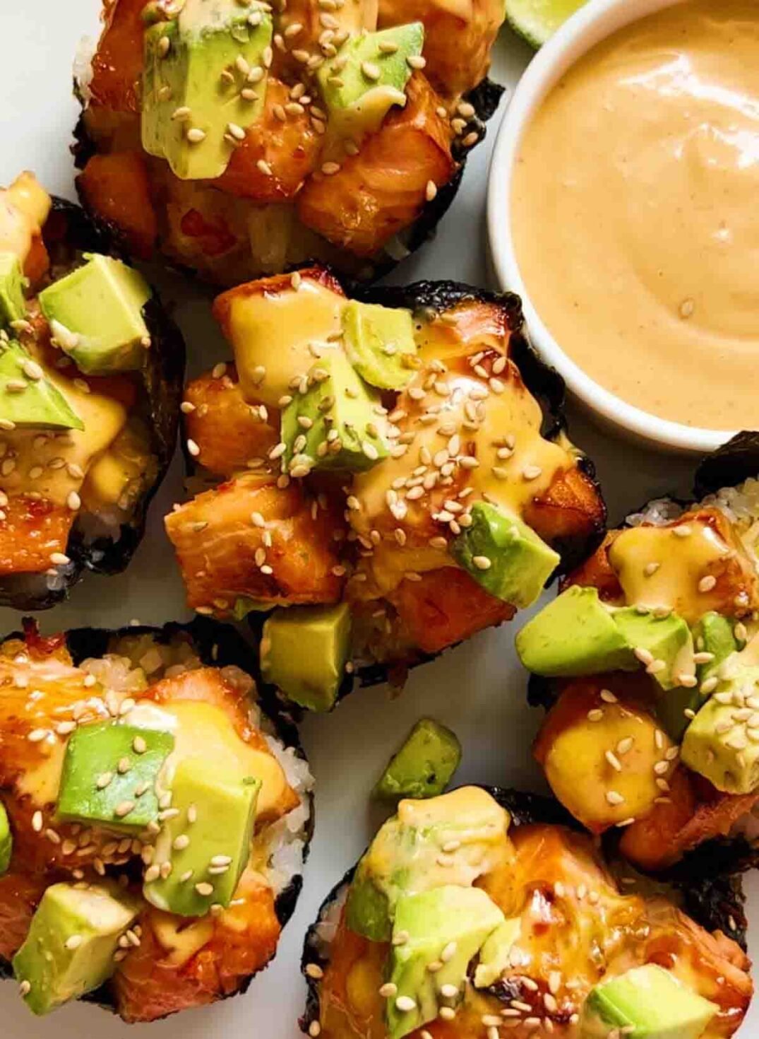 an up close view of sweet chili glazed baked salmon sushi cups