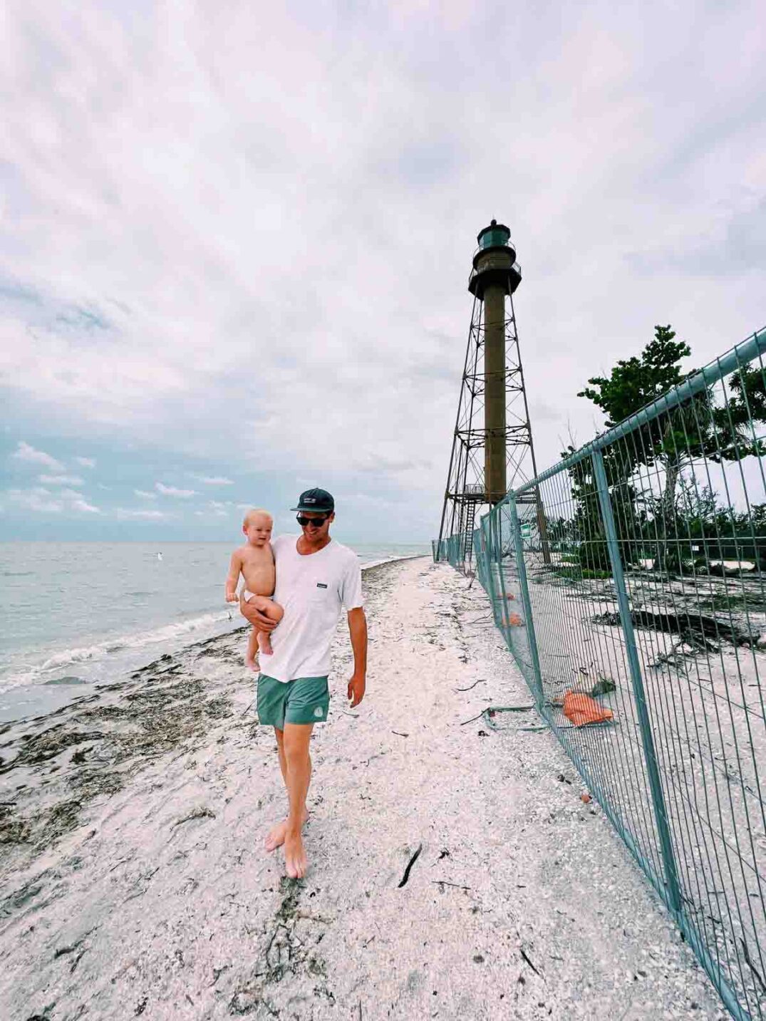 jeremy johnston and jetty johnston walking along the sanibel lighthouse beach after hurricane ian.