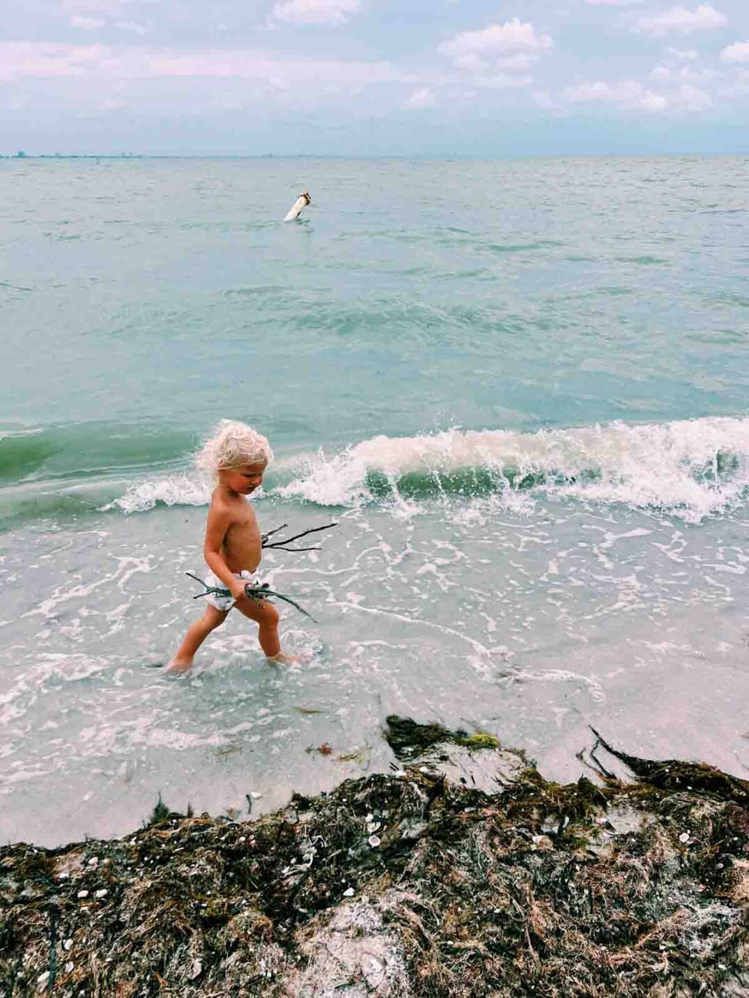 poppy johnston walking along the beach of captiva after hurricane ian.