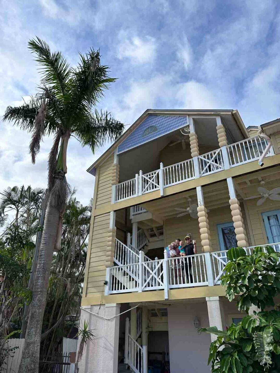 a yellow 3 story house on andy rosse street on captiva island. 