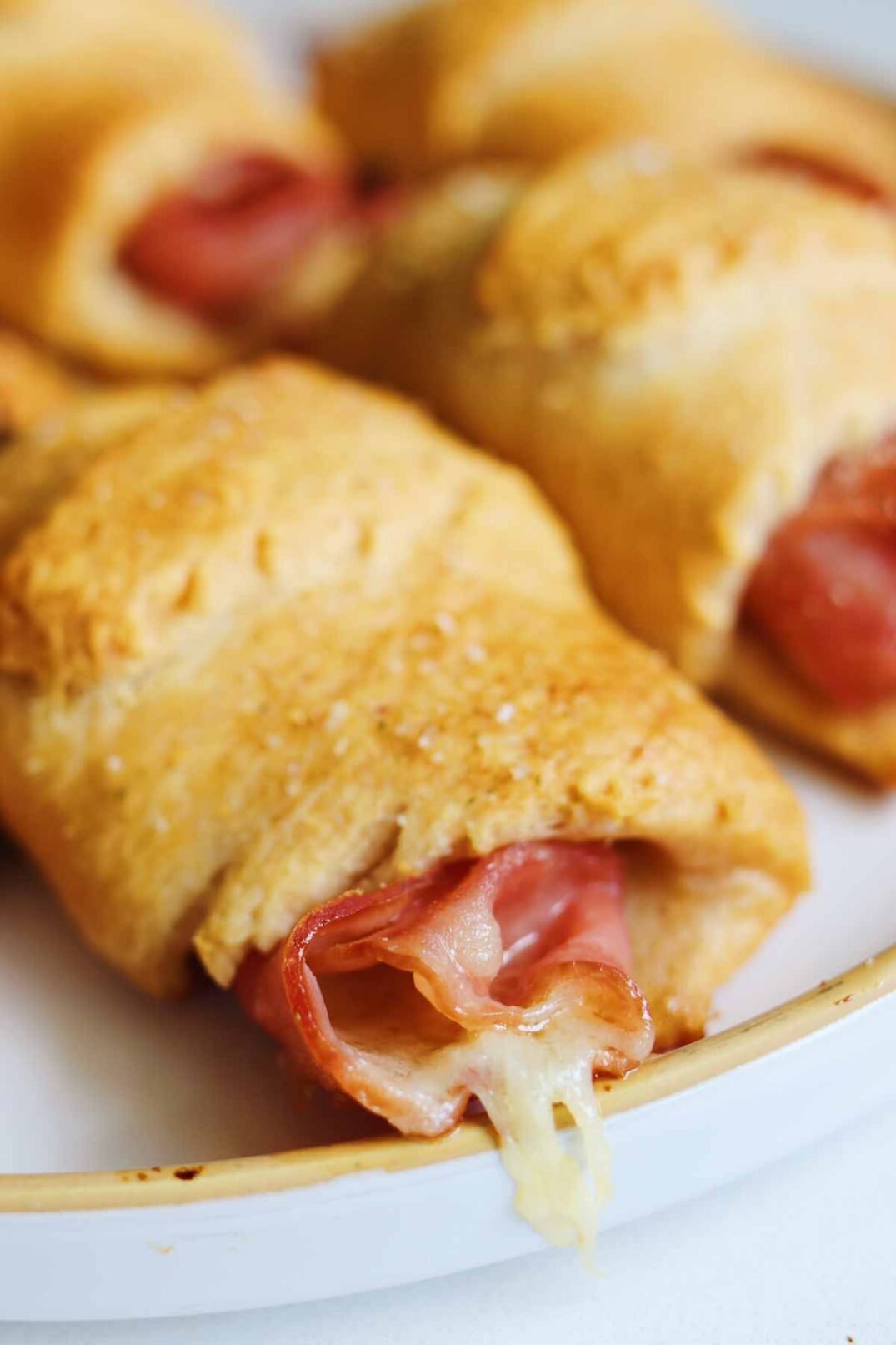 Ham and Cheese Crescent Rolls on a white plate
