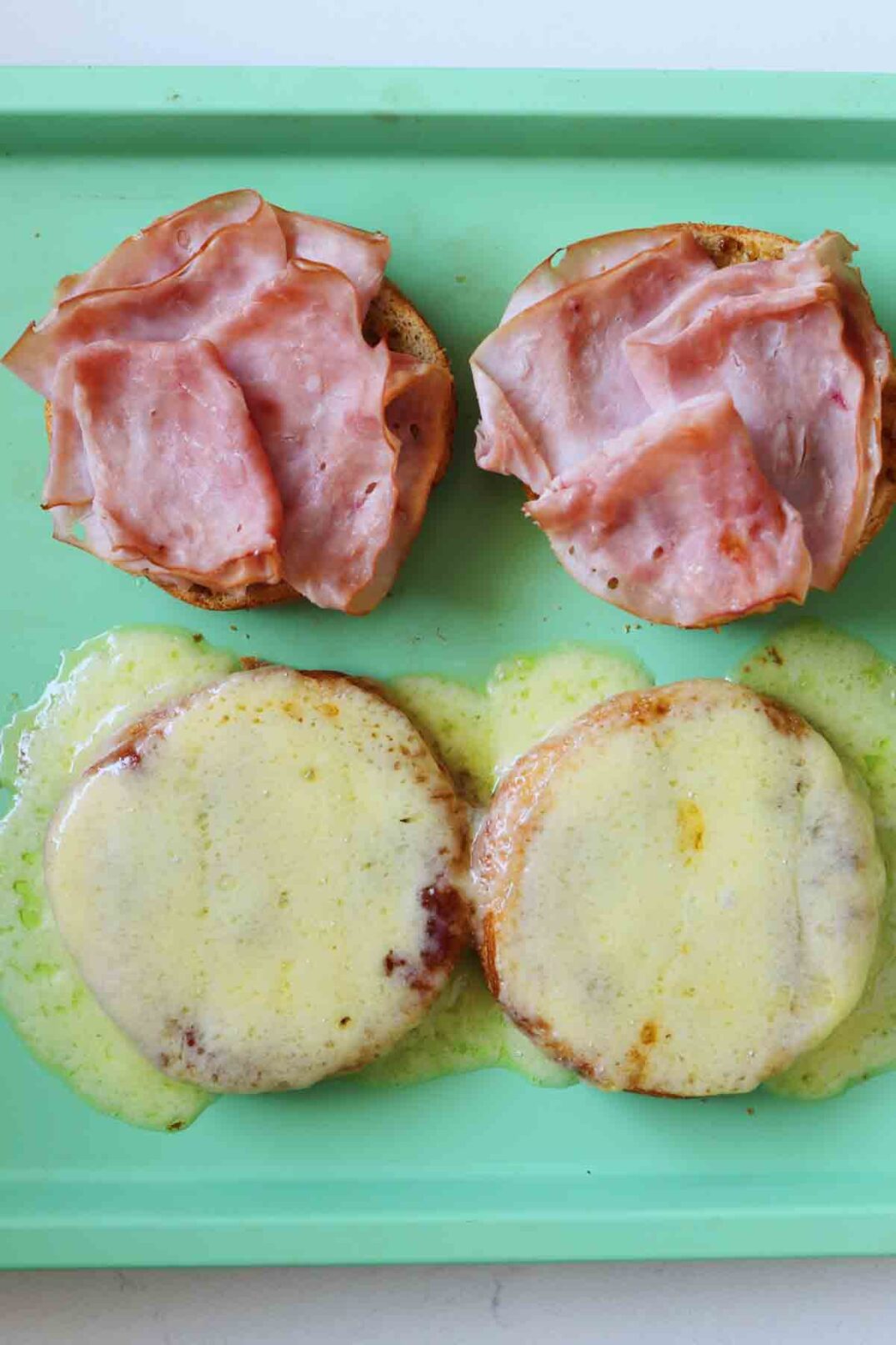 melted comte and caramelized ham on croissant buns.