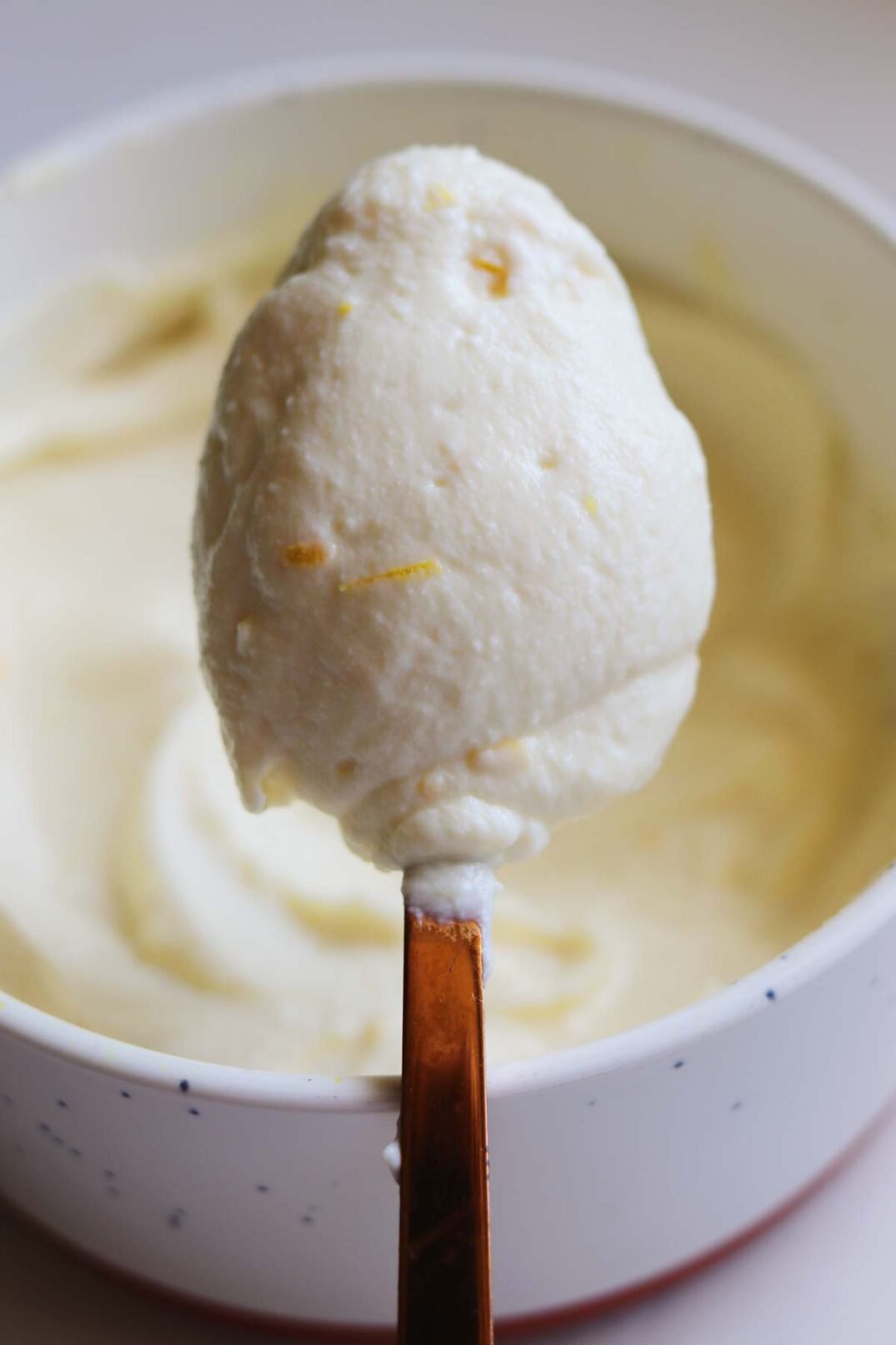 a spoonful of whipped honey ricotta over a bowl of it.
