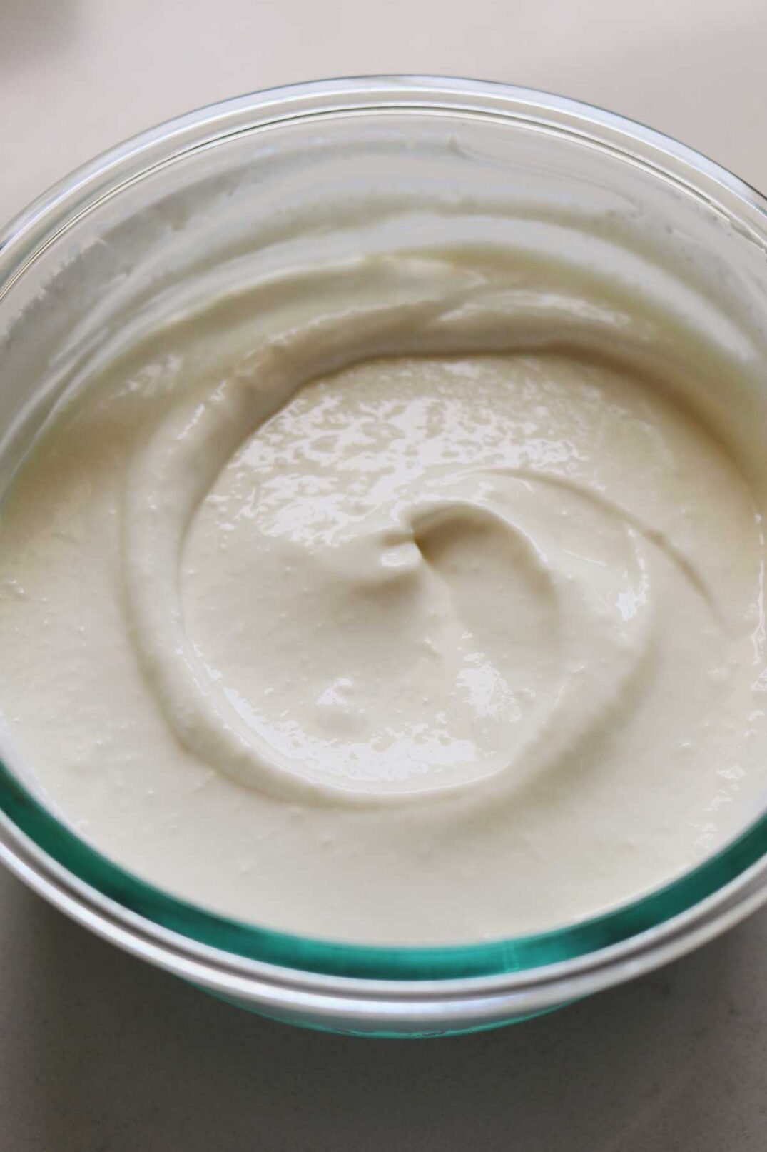 smooth and creamy whipped cottage cheese in a glass bowl.