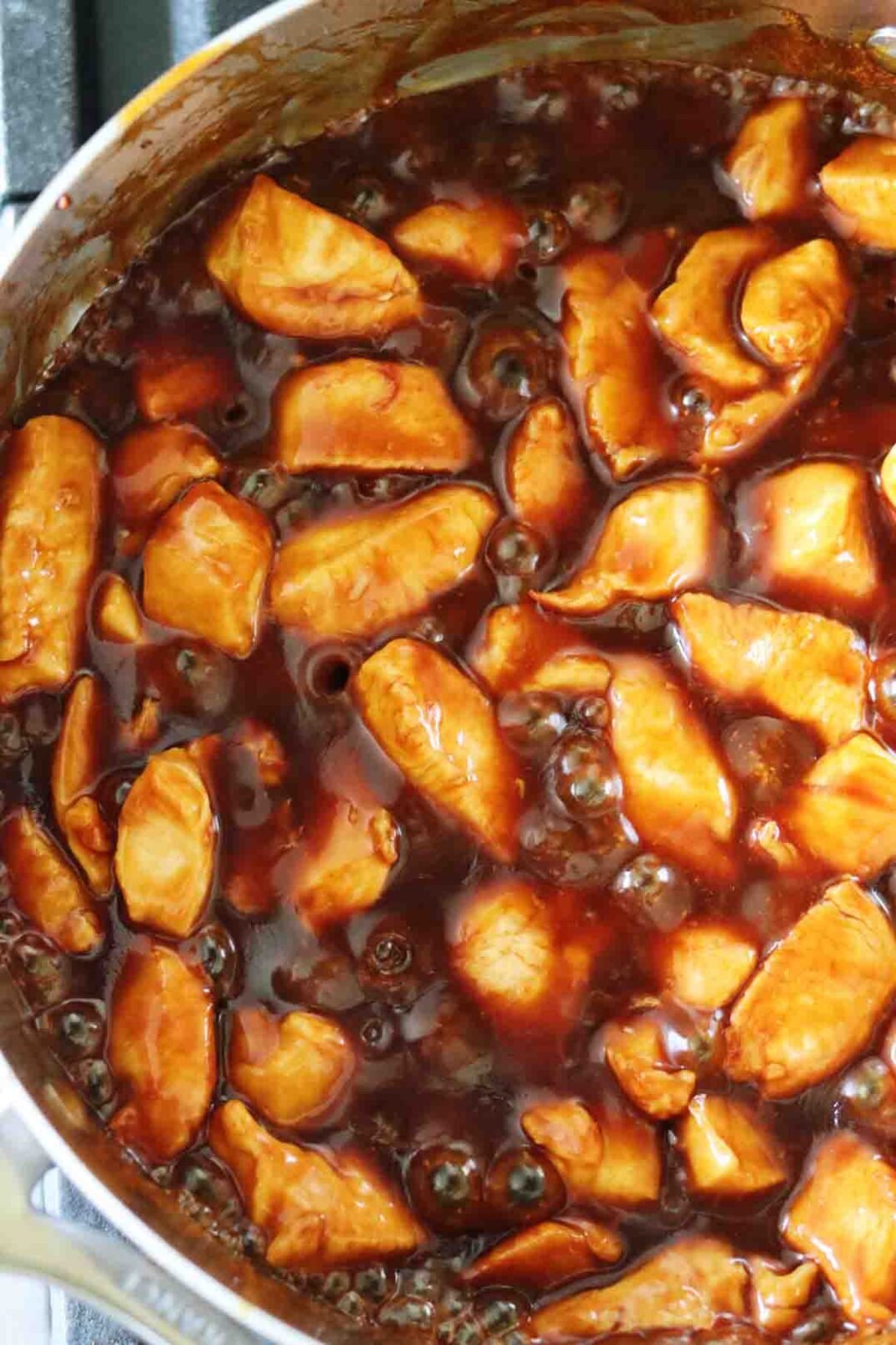 bourbon chicken bubbling in its sauce. 