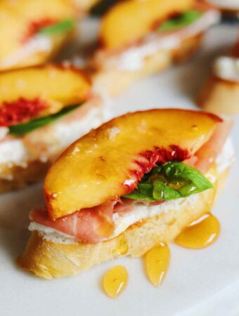 peaches on a ricotta smeared crostini topped with honey honey.