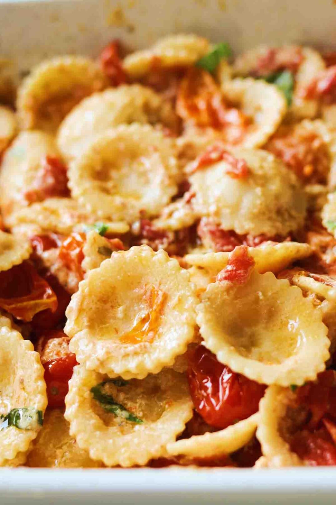 a birds eye view of Baked Boursin Cheese Pasta Recipe in a white baking dish.