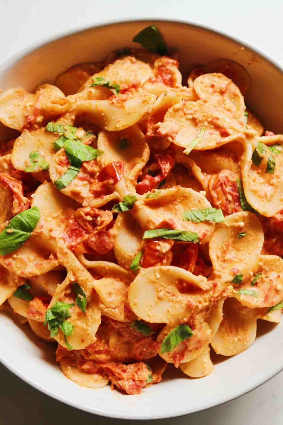 baked hummus feta pasta in a white bowl. 