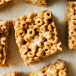 a piece of parchment paper topped with brown butter pumpkin spice cheerio treats