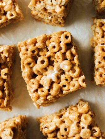 a piece of parchment paper topped with brown butter pumpkin spice cheerio treats