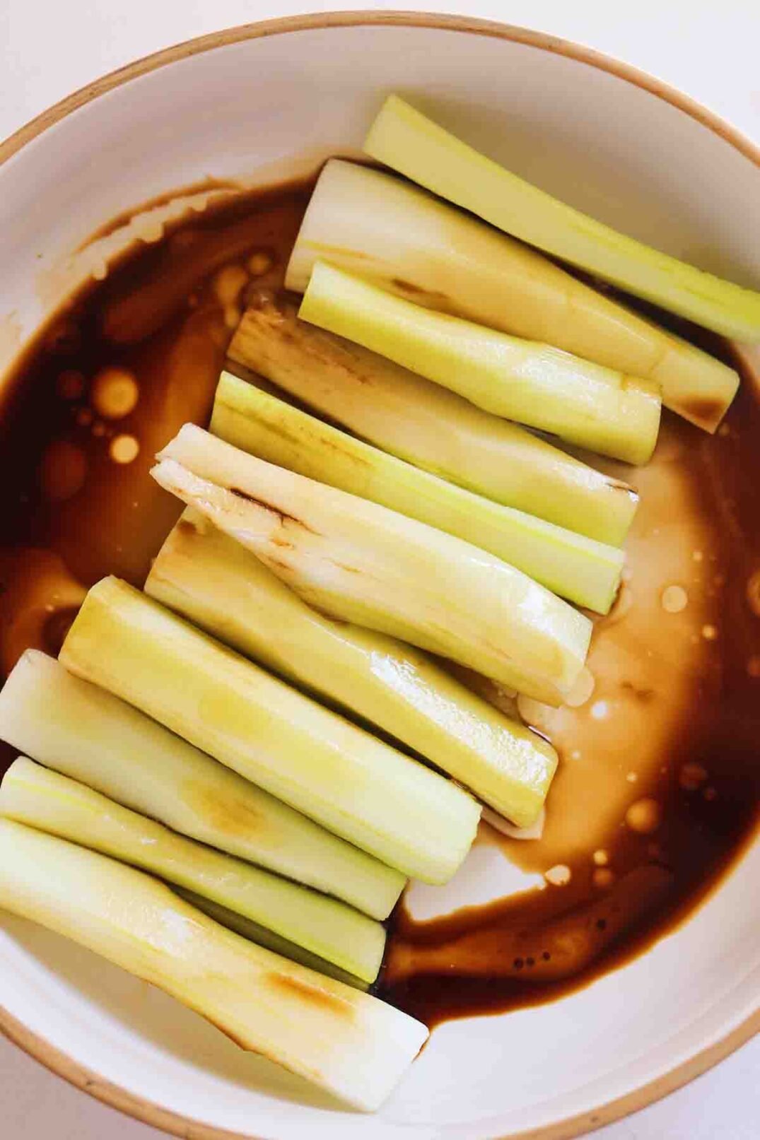 trimmed celery swimming in sesame oil, soy sauce and rice wine vinegar. 