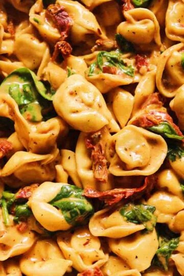 a close up view of a bowl of marry me tortellini.