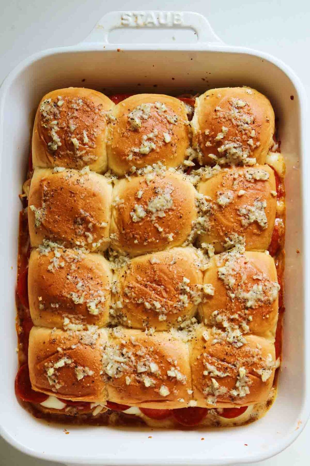 pepperoni pizza sliders in a white baking dish, 