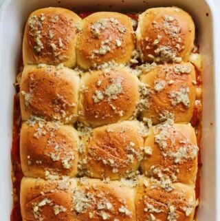 pepperoni pizza sliders in a white baking dish,