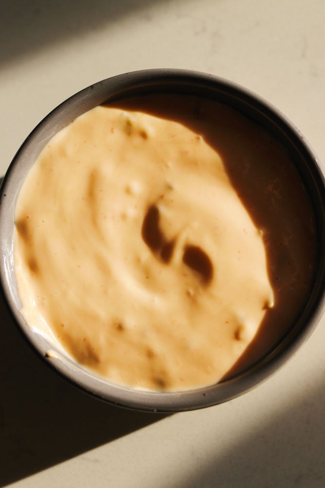 an overhead view of a bowl of smashburger sauce.