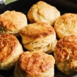 homemade honey butter biscuits in a cast iron skillet