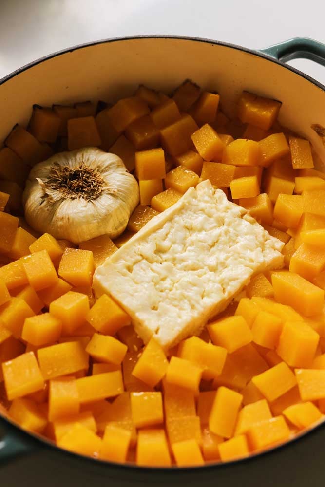 baked cubes of butternut squash with feta and roasted garlic. 