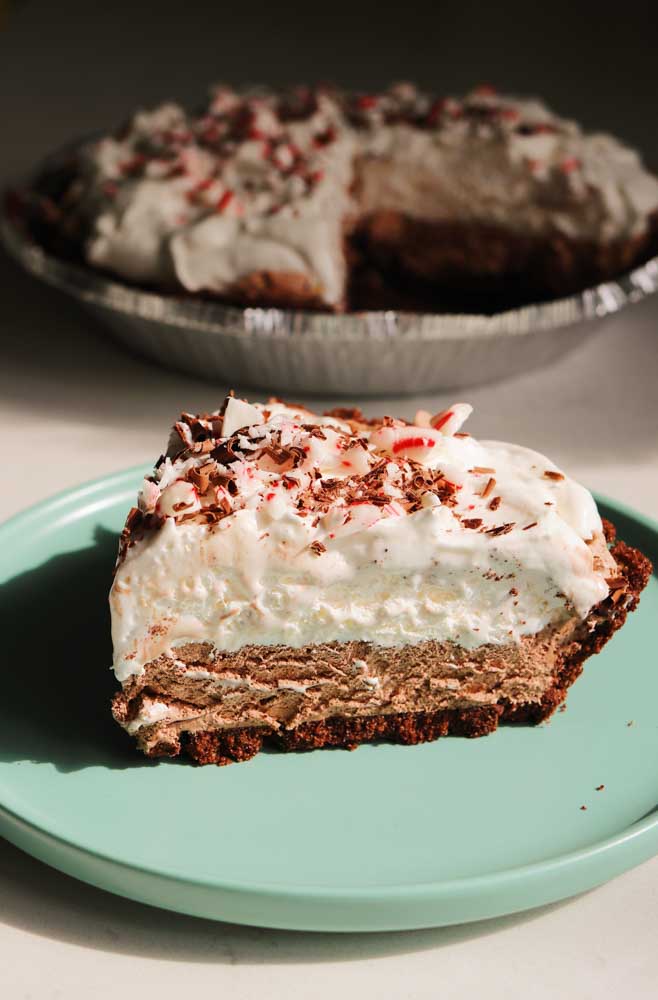 a piece of frozen hot chocolate pie sitting in front of the pie itself.