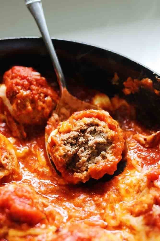 an up close view of the inside of a ricotta meatball.