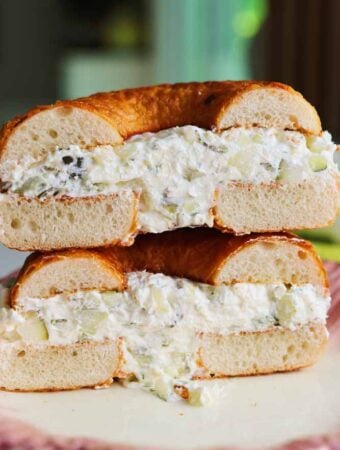 a cheese bagel stuffed with dill pickle cream cheese.