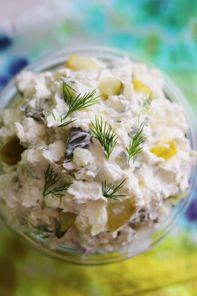 an overhead view of a jar of dill pickle cream cheese.