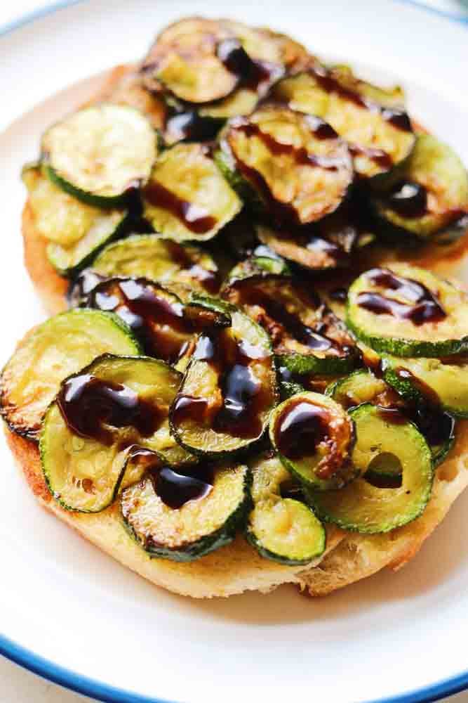 caramelized zucchini coins topped with balsamic reduction. 