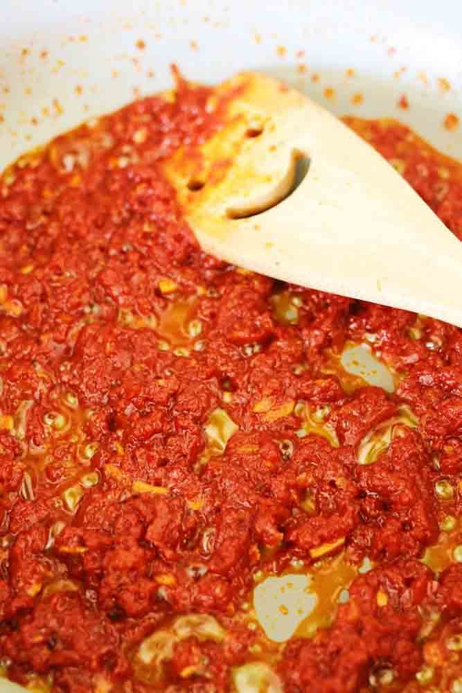 vodka and tomato paste mixture in a pan. 
