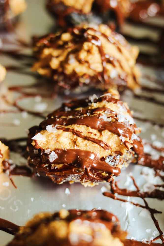 an up close view of butterfinger stuffed dates with flaky salt on top. 